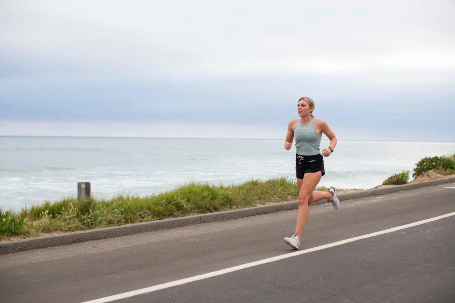 A woman running along the beach